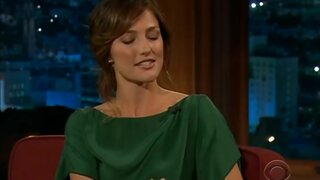 Minka Kelly leggy in green on the Late Late Show