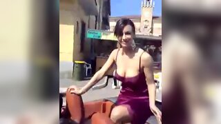 Melita Toniolo amateur video with a guy zooming on her deep cleavage