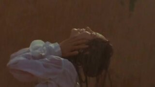 Kristin Kreuk outside in the rain in Partition