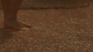 Kristin Kreuk outside in the rain in Partition