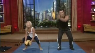 Kelly Ripa working out with a ball