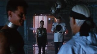 Carrie Fisher in skintight metal top in The Time Guardian