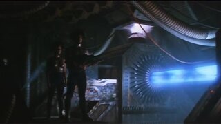 Carrie Fisher in skintight metal top in The Time Guardian