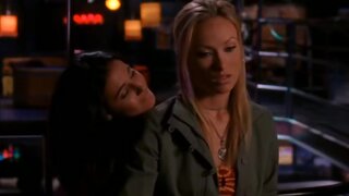 Emmanuelle Chriqui kissing Olivia Wilde in Newport Beach