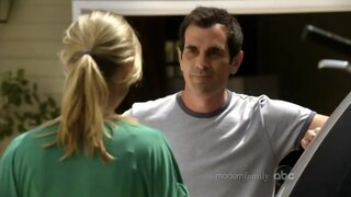 Brandy Ledford in sports bra on Modern Family S1e2a