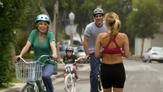 Brandy Ledford in sports bra on Modern Family S1e2a