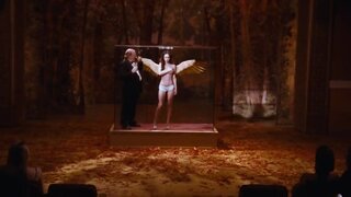 Megan Fox holding her bare boobs in Passion Play