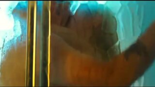 Maria Bello showing some skin in Yellow handkerchief